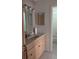 Bathroom features light wood cabinets and tile flooring at 1617 Shady Ridge Ct # 257, Orlando, FL 32807
