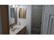 Bathroom with a single sink vanity and a shower-tub combo at 1617 Shady Ridge Ct # 257, Orlando, FL 32807