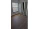 Bedroom features wood floors, closet and natural light at 1617 Shady Ridge Ct # 257, Orlando, FL 32807
