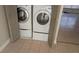 Laundry area with closet doors featuring new washer and dryer at 1617 Shady Ridge Ct # 257, Orlando, FL 32807