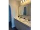 Bathroom featuring double sink vanity, large mirror and neutral color palette at 207 Aidans Lndg, Haines City, FL 33844