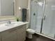 Modern bathroom featuring a glass shower, a sleek vanity, and neutral tones at 207 Aidans Lndg, Haines City, FL 33844