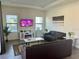 Cozy living room featuring comfortable sofas, a modern TV, and stylish decor at 207 Aidans Lndg, Haines City, FL 33844
