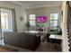 Comfortable living room with modern furniture, a large TV, and a fireplace at 207 Aidans Lndg, Haines City, FL 33844