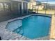 Private screened-in pool with a safety fence and a spacious deck at 207 Aidans Lndg, Haines City, FL 33844