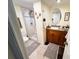 A bathroom featuring a vanity, toilet and a shower with glass enclosure at 207 Jacaranda Dr, Leesburg, FL 34748