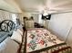 The bedroom offers space with the closet and decorative bedding at 207 Jacaranda Dr, Leesburg, FL 34748