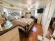 The main bedroom with a bed, wood floors, and closet, a space designed for relaxation at 207 Jacaranda Dr, Leesburg, FL 34748