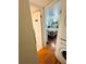Bedroom entryway adjacent to the laundry room with a door labelled 'ladies' at 207 Jacaranda Dr, Leesburg, FL 34748