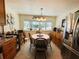 Inviting dining nook featuring bright natural light and stainless steel refrigerator at 207 Jacaranda Dr, Leesburg, FL 34748