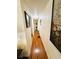 Hallway with washer and dryer and wood-look floors at 207 Jacaranda Dr, Leesburg, FL 34748