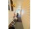 Exterior view of hallway featuring a window, exterior lighting, and a grill at 207 Jacaranda Dr, Leesburg, FL 34748