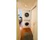 Hallway laundry room with stacked washer and dryer next to the bedroom at 207 Jacaranda Dr, Leesburg, FL 34748