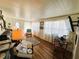 Cozy living room with hardwood floors and abundant natural light at 207 Jacaranda Dr, Leesburg, FL 34748