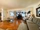 Open concept living area featuring hardwood floors and modern furnishings at 207 Jacaranda Dr, Leesburg, FL 34748