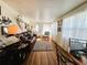 Inviting living room with hardwood floors and bright natural light streaming in at 207 Jacaranda Dr, Leesburg, FL 34748