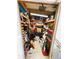 Interior view of the storage area filled with boxes, tools, and household items at 207 Jacaranda Dr, Leesburg, FL 34748