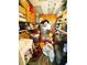 Interior view of the storage area filled with boxes, cleaning supplies, and household items at 207 Jacaranda Dr, Leesburg, FL 34748