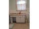 Functional bathroom with a vanity, offering storage and convenience in a clean and simple design at 225 E Cummings St, Lake Alfred, FL 33850