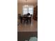 Inviting dining room with a chandelier and classic décor, creating an elegant setting for meals at 225 E Cummings St, Lake Alfred, FL 33850