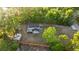 Aerial view of the home showcasing the backyard, fencing, and surrounding trees at 2449 E Lake Dr, Deland, FL 32724