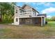 Exterior back of house with screened in porch at 2449 E Lake Dr, Deland, FL 32724