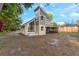 Backyard with an outdoor patio and tree line at 2449 E Lake Dr, Deland, FL 32724