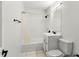 Clean bathroom with white tile, vanity, and shower with tub at 2449 E Lake Dr, Deland, FL 32724