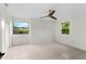 Bright bedroom with two windows and tile floors at 2449 E Lake Dr, Deland, FL 32724