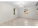 Bedroom featuring tile floors and a stylish chandelier at 2449 E Lake Dr, Deland, FL 32724
