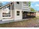 Charming home exterior featuring a screened porch and architectural windows at 2449 E Lake Dr, Deland, FL 32724
