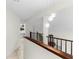 Upstairs hallway with tile floor and modern lighting at 2449 E Lake Dr, Deland, FL 32724
