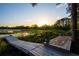 Picturesque lake view with wooden dock and serene natural surroundings at 2449 E Lake Dr, Deland, FL 32724