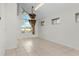 Bright living room featuring tile floors, large windows, and an elegant chandelier at 2449 E Lake Dr, Deland, FL 32724