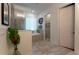 This modern bathroom features a glass enclosed shower, a garden tub and tile floors at 25879 Crossings Bluff Ln, Sorrento, FL 32776