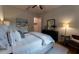 This bedroom features an area rug, a ceiling fan, and a neutral color scheme at 25879 Crossings Bluff Ln, Sorrento, FL 32776