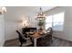 Bright dining area featuring modern chandelier, wall decor, seating and natural light at 25879 Crossings Bluff Ln, Sorrento, FL 32776