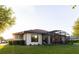 A well maintained single story home surrounded by lush green lawn at 25879 Crossings Bluff Ln, Sorrento, FL 32776