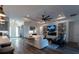 Open living room showcases modern fireplace, built-in shelves, hardwood floors and neutral decor at 25879 Crossings Bluff Ln, Sorrento, FL 32776