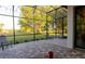 An outdoor living space with brick flooring, a screened enclosure, and comfortable seating areas at 25879 Crossings Bluff Ln, Sorrento, FL 32776
