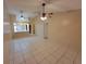 Spacious living room with tile flooring, ceiling fans, and an open layout at 2910 Western Willow Ter, Orlando, FL 32808