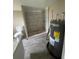 Bathroom with newly tiled shower, toilet, and water heater at 309 Old Mission Rd, New Smyrna Beach, FL 32168