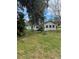 Charming home with a well-maintained yard and mature trees, a serene setting at 309 Old Mission Rd, New Smyrna Beach, FL 32168