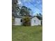 Exterior view of home showcasing palm tree at 309 Old Mission Rd, New Smyrna Beach, FL 32168