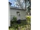 Exterior view of the home's siding, windows, and an air conditioner at 309 Old Mission Rd, New Smyrna Beach, FL 32168