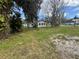 Exterior view of the property highlighting the surrounding lush greenery and neighborhood street at 309 Old Mission Rd, New Smyrna Beach, FL 32168