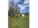 Charming home with a lush, green lawn and mature trees at 309 Old Mission Rd, New Smyrna Beach, FL 32168