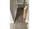 Hallway with gray walls and damaged laminate floor at 309 Old Mission Rd, New Smyrna Beach, FL 32168