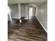 Spacious living room featuring wood-look flooring and natural light at 309 Old Mission Rd, New Smyrna Beach, FL 32168