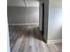 Room with wood-look flooring and a doorway entrance to another space at 309 Old Mission Rd, New Smyrna Beach, FL 32168